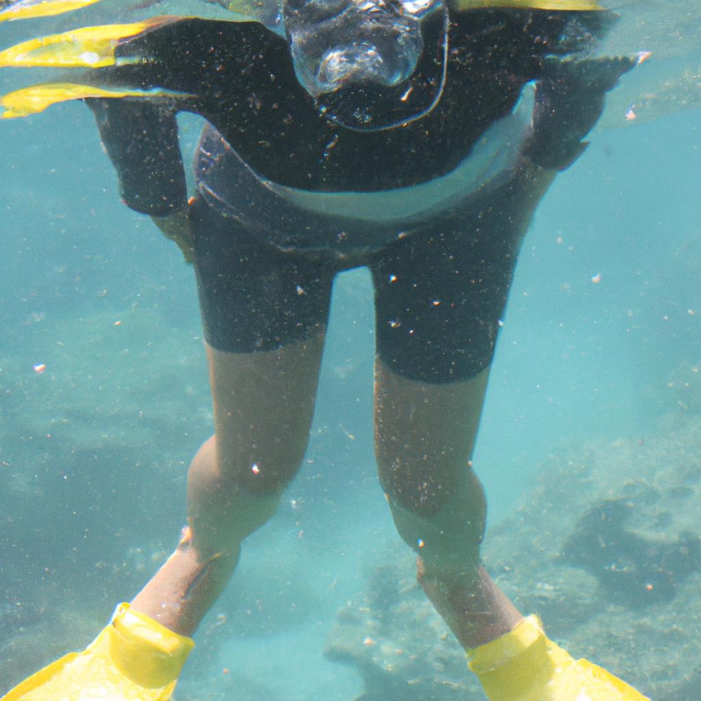 Person wearing snorkeling gear underwater
