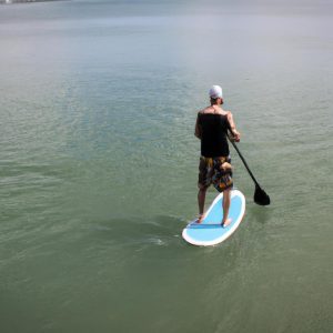 Person paddleboarding on different boards
